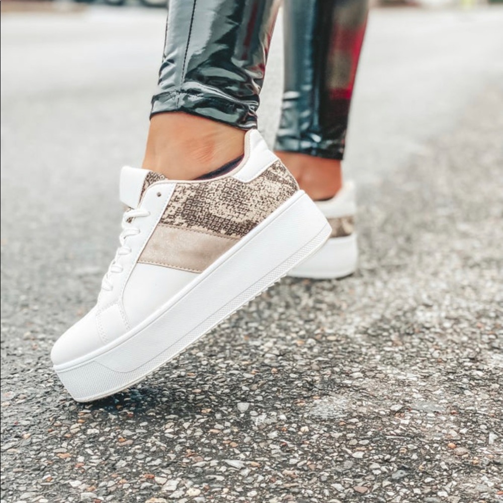 Very rare snakeskin platform sneaker. Purchased from a boutique that sold out.